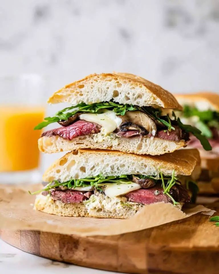 Grilled Steak Sandwiches with Caramelized Onions, Brie, and Horseradish Sauce Recipe