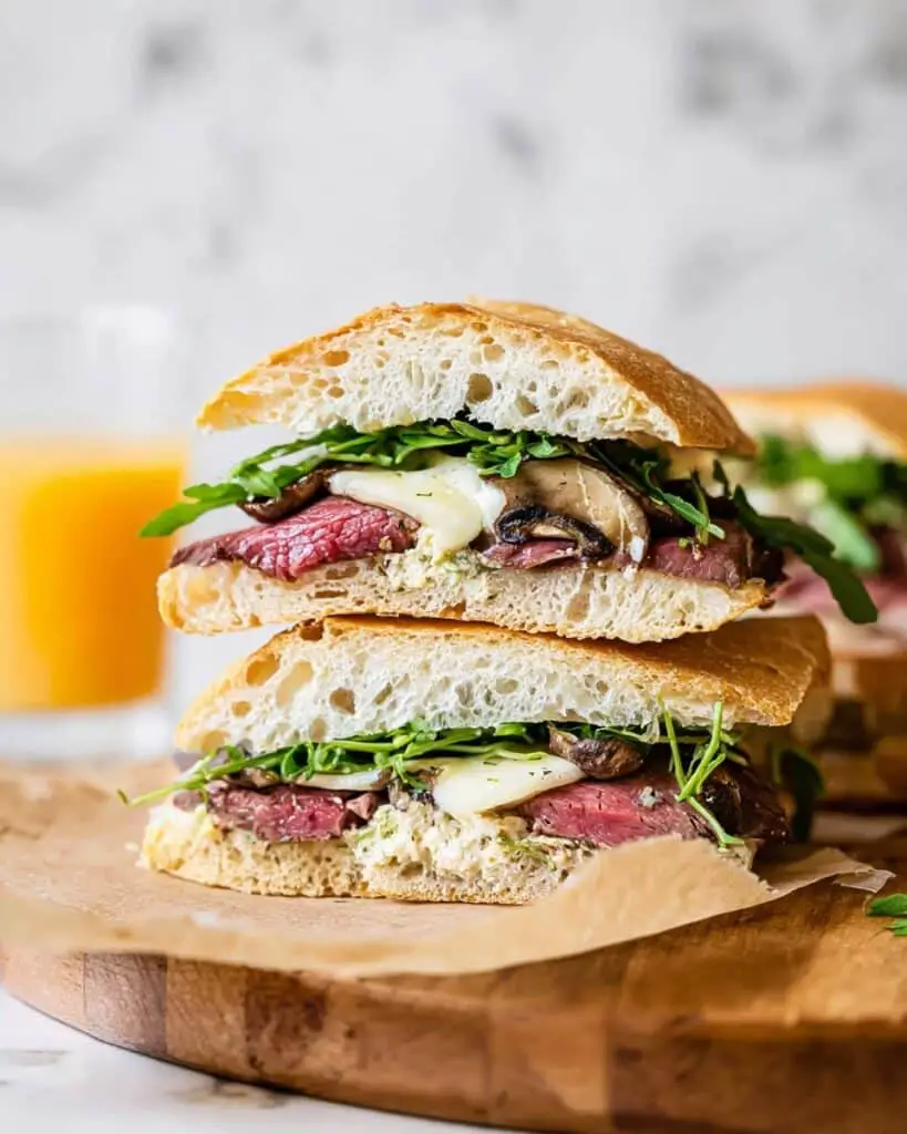 Grilled Steak Sandwiches with Caramelized Onions, Brie, and Horseradish Sauce Recipe
