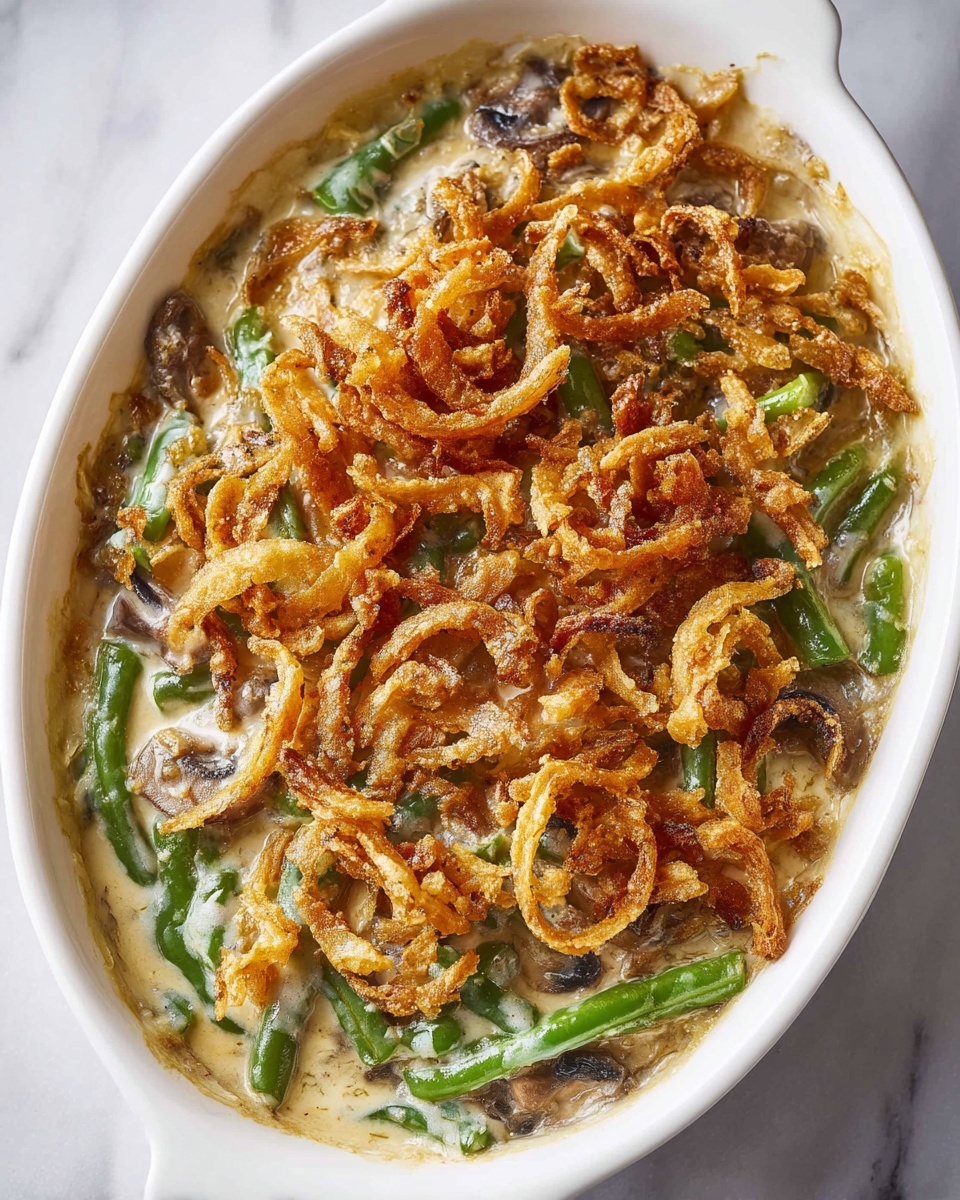The dish shows a white oval baking dish filled with a creamy green bean casserole. The casserole has several layers: at the bottom, green beans mixed in white sauce with small chunks of tender chicken pieces; on top, golden-brown crispy fried onions scattered evenly across the surface. A wooden spoon held by a woman's hand is lifting a portion of the casserole, showing green beans coated in the creamy sauce with crispy onions on top. The dish is placed on a white marbled surface, and a red and white striped cloth is partially visible near the dish. Photo taken with an iphone --ar 4:5 --v 7