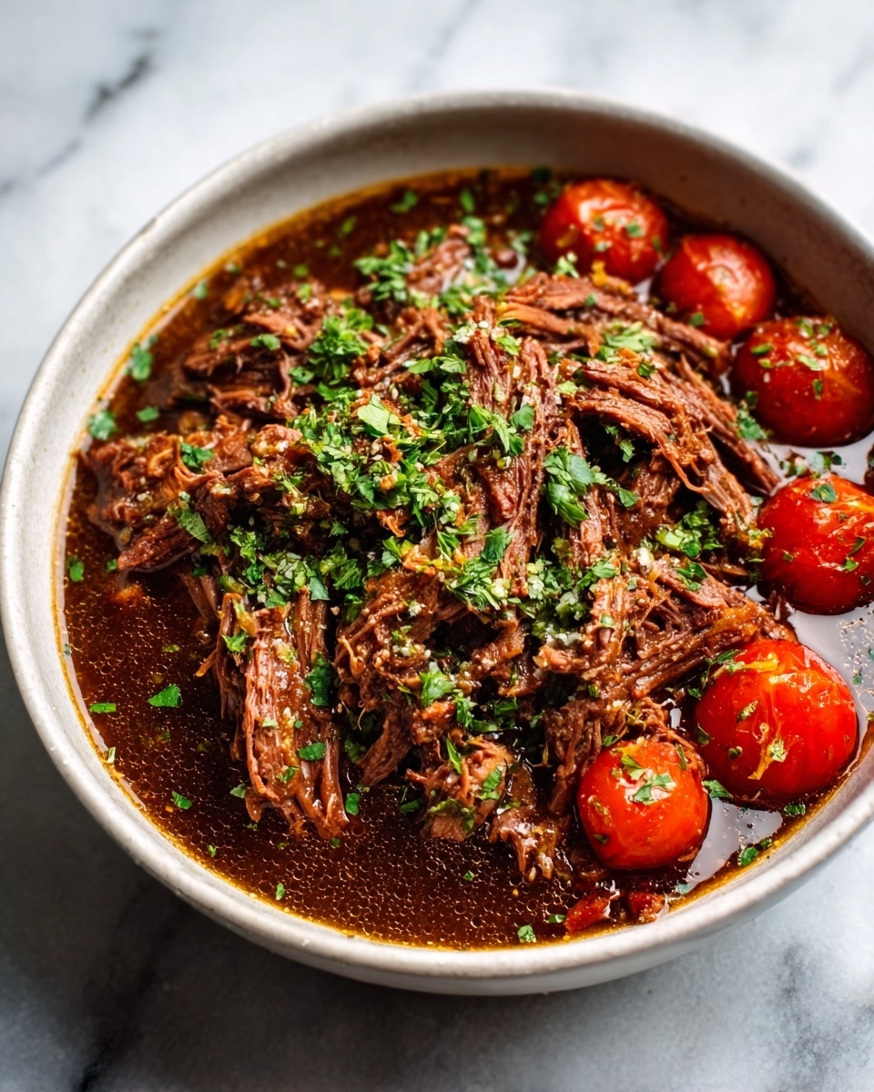 A white bowl filled with shredded brown cooked meat in a rich dark brown sauce, topped with chopped green herbs sprinkled evenly on top. Small red cherry tomatoes are arranged on one side of the meat inside the bowl. The bowl is placed on a white marbled surface. photo taken with an iphone --ar 4:5 --v 7