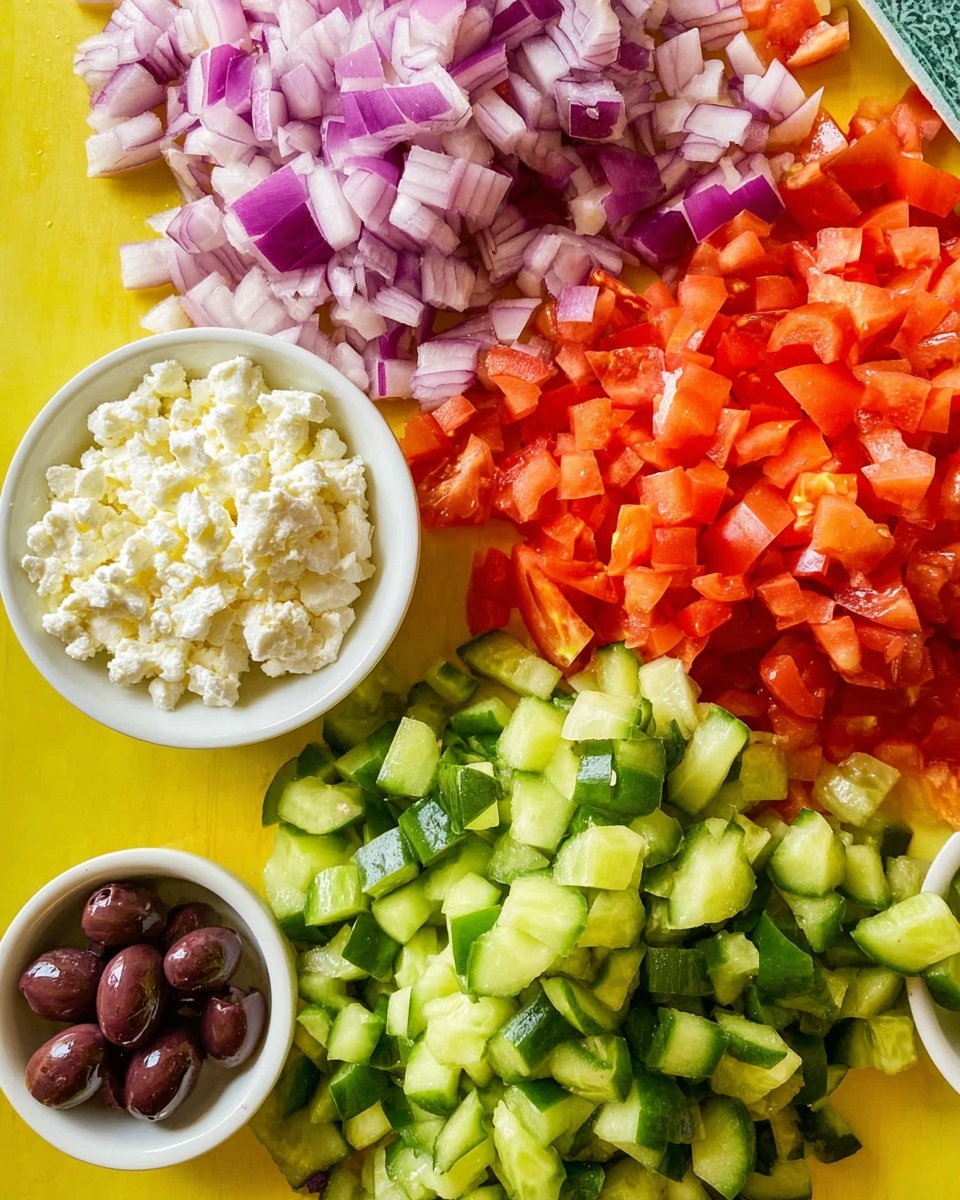 The image shows a close-up of finely chopped vegetables arranged on a bright yellow surface: at the top left corner there is a small pile of chopped red onions with purple and white shades, next to a larger pile of diced tomatoes with bright red and orange colors evenly spread out, below that is a generous mound of chopped green cucumbers featuring light green flesh and dark green skin, and on the left side there are two small white bowls, one filled with white crumbly cheese and the other containing a few glossy dark purple olives. The overall composition is colorful and fresh with soft natural lighting, photo taken with an iphone --ar 4:5 --v 7