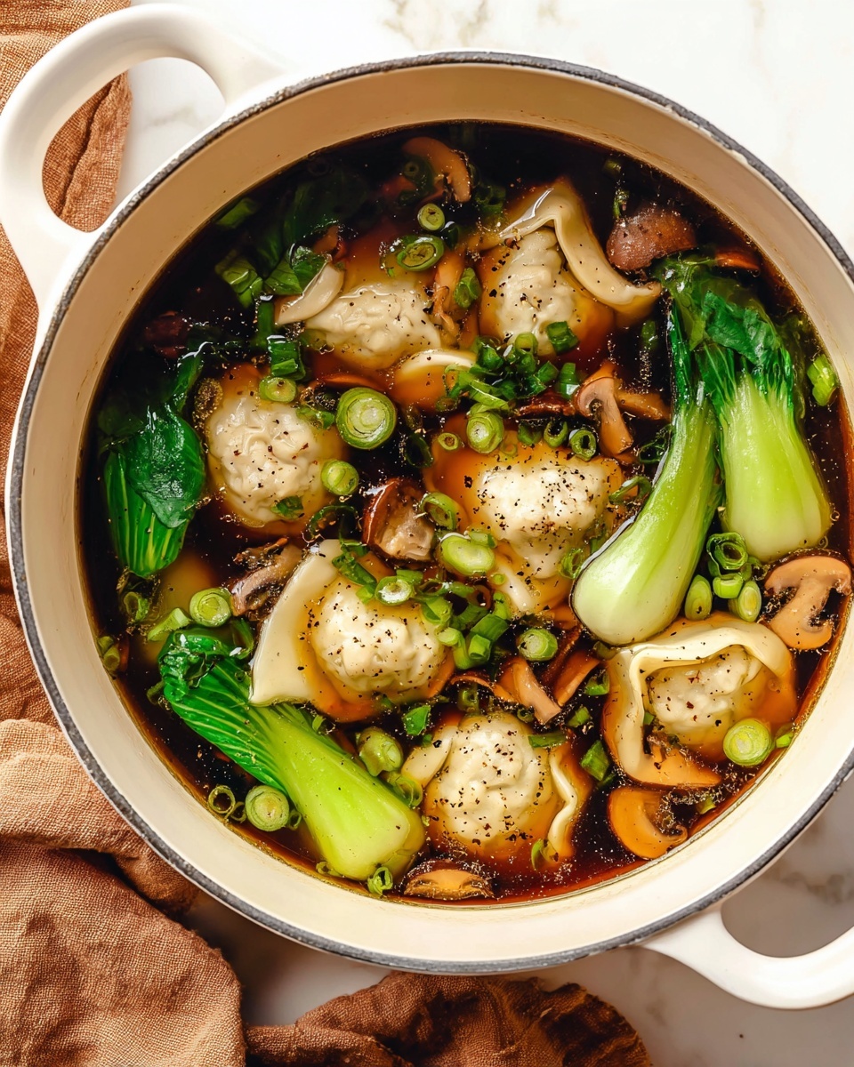 A white bowl filled with a dark broth containing various layers of food, including thin layers of light beige mushroom-like pieces floating on top, bright green leafy vegetables scattered throughout, and pieces of pale yellow bamboo shoots. Small round green peas or seeds are spread across the soup surface. The bowl rests on a white marbled surface with a brown cloth peeking from underneath on one side. Photo taken with an iphone --ar 4:5 --v 7
