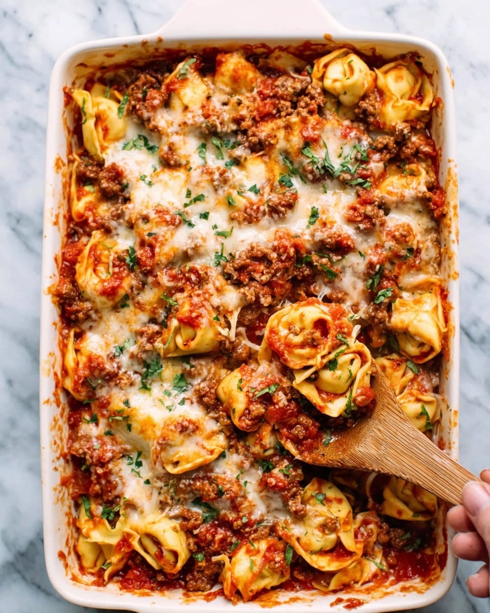 A white rectangular baking dish filled with layered lasagna. The bottom layer is thick with brown cooked meat sauce mixed with red tomato sauce. Above that is a layer of wide flat pasta sheets with a soft yellow color. On top, there is a generous layer of melted white cheese, slightly browned and bubbly, with small green parsley pieces sprinkled evenly. A spoon rests inside the dish at the corner, partially scooping out some lasagna. The dish is placed on a white marbled surface with a gray cloth partially underneath, and a small bowl of green herbs and an oil bottle can be seen nearby. Photo taken with an iphone --ar 4:5 --v 7