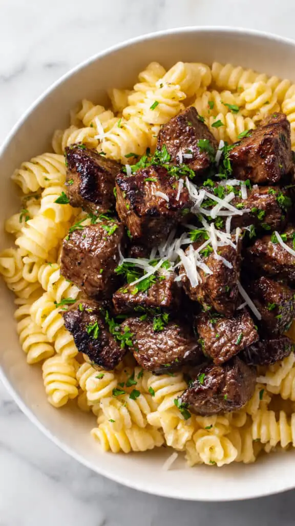 Cajun Steak Tips in Cheesy Rigatoni Parmesan Sauce Recipe