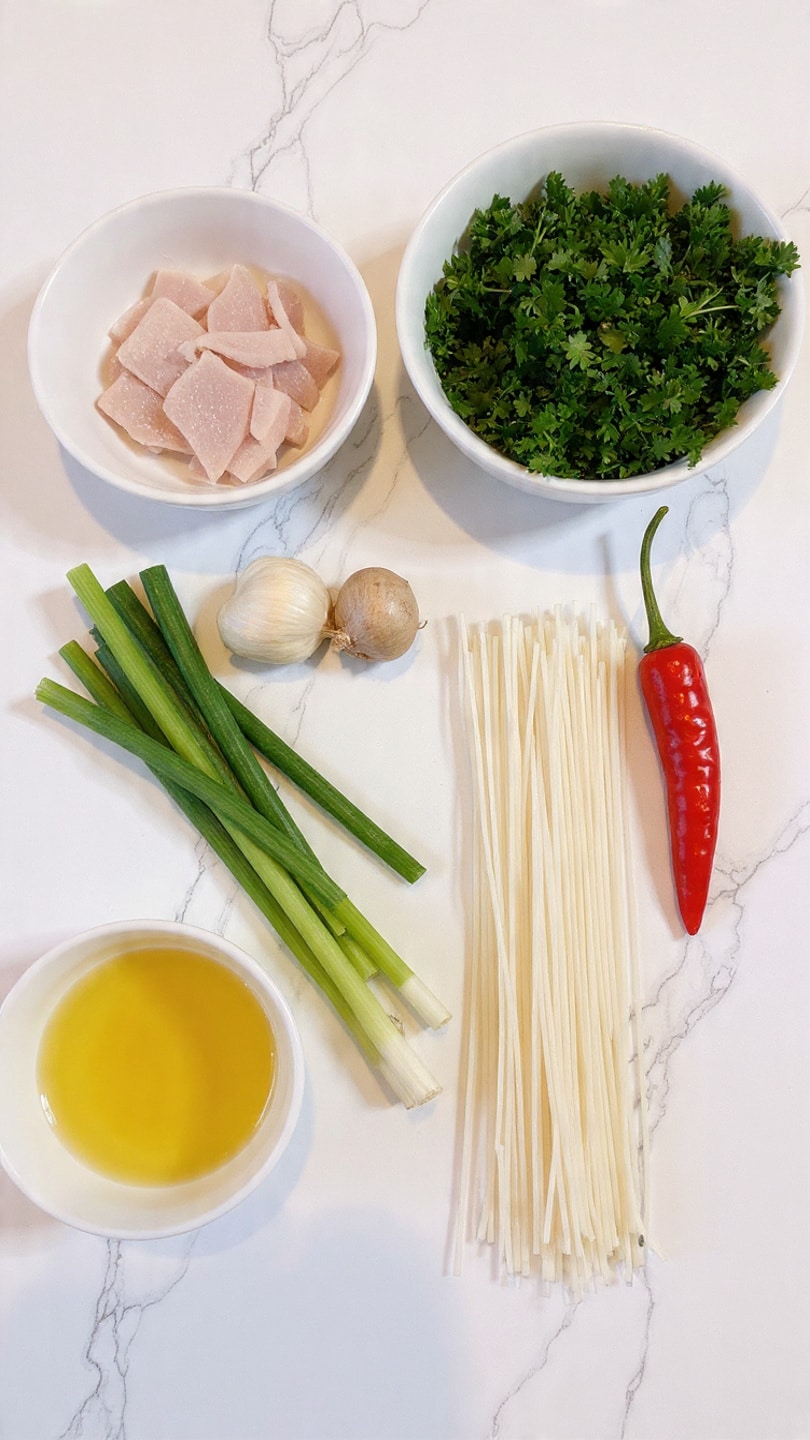 The image shows ingredients arranged on a white marbled surface: a bunch of fresh green cilantro on the top right, white thin noodles spread out below the cilantro, and a bright red chili pepper next to the noodles. On the left side, there are green onions with white stalks, a bulb of garlic, a piece of ginger root, a white bowl filled with thin white slices of a light-colored meat, and a white bowl with a yellow liquid. The items are neatly placed with clear colors and textures. photo taken with an iphone --ar 4:5 --v 7