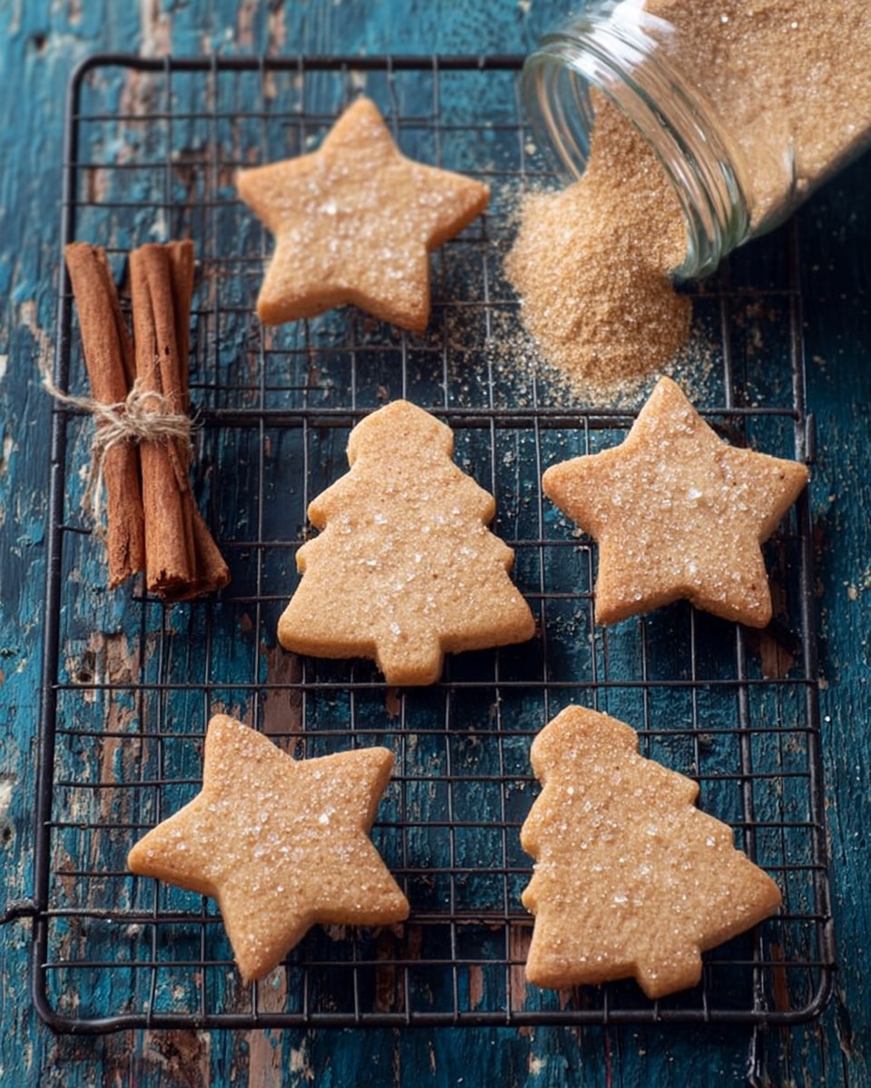 The image shows six light brown cookies shaped like stars and Christmas trees. The cookies are on a black cooling rack, placed over a worn blue wooden surface. Each cookie has a thin layer of sugar sprinkled on top, giving them a slightly sparkly look. On the left edge, there is a small bundle of cinnamon sticks tied with string. In the upper right corner, a glass jar tipped on its side pours light brown sugar onto the surface. The textures include the smooth, slightly rough cookie tops, the shiny sugar crystals, and the rustic wood surface underneath. Photo taken with an iphone --ar 4:5 --v 7