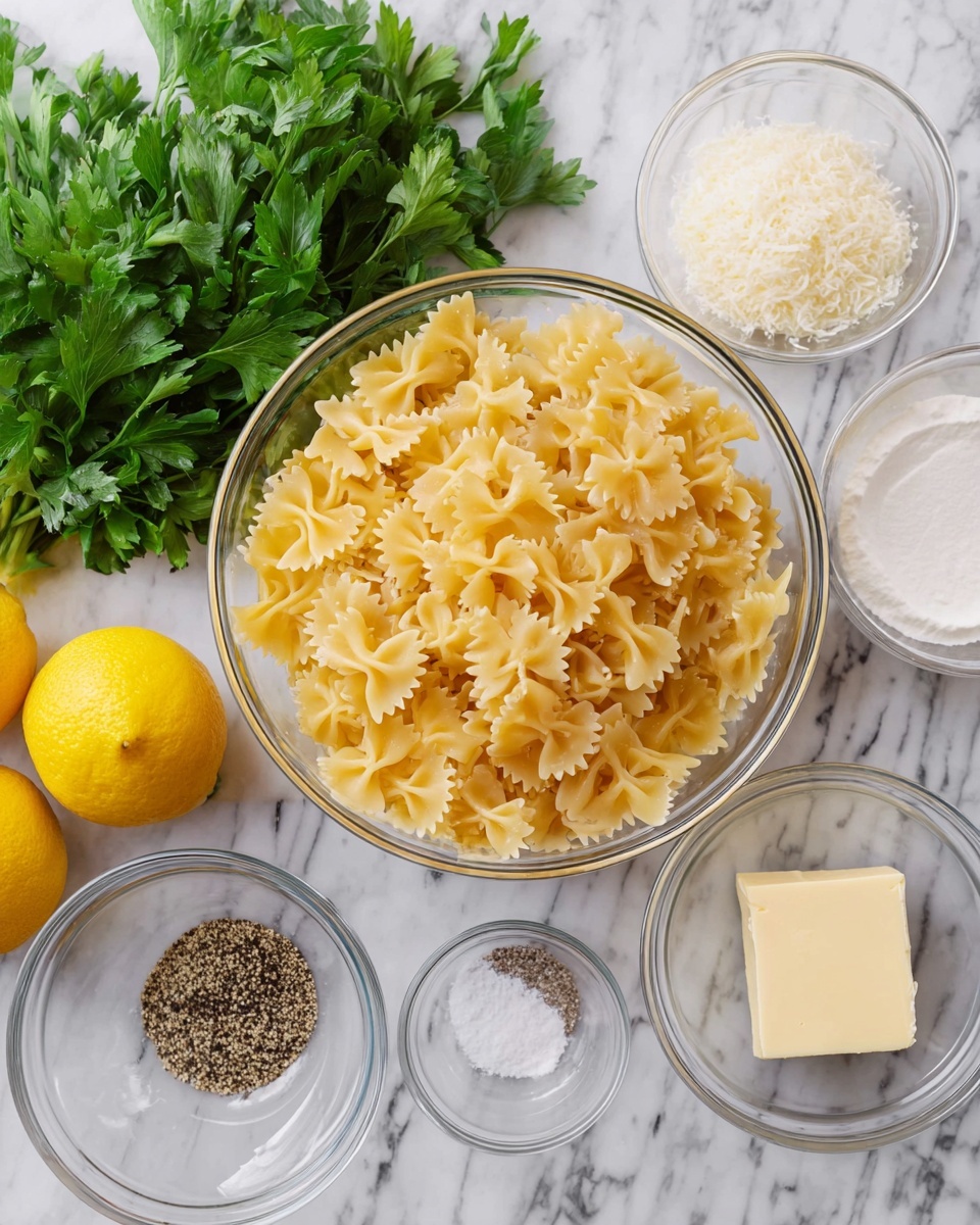The image shows a white marbled surface with ingredients set out for cooking. In the center, there is a large clear glass bowl filled with light yellow uncooked bowtie pasta. Surrounding it are smaller clear glass bowls, each containing different ingredients: one with white coarse salt, one with black pepper granules, one with grated parmesan cheese, and another with a square piece of butter. To the left, there is a cluster of fresh green parsley leaves and two whole yellow lemons placed next to a white container filled with a creamy white substance. The scene is clean and bright, with a neat arrangement of ingredients ready for use. Photo taken with an iphone --ar 4:5 --v 7
