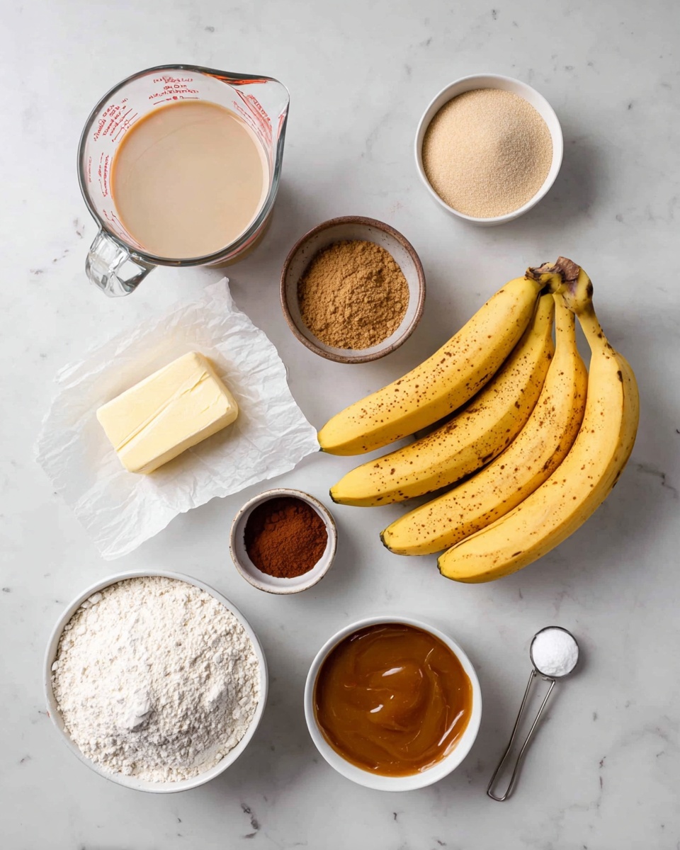 The image shows several baking ingredients arranged neatly on a white marbled surface. Starting from the top left corner, there is a clear glass measuring cup with a light beige liquid inside, followed to the right by a small white dish holding a light beige powder. Below is a small light gray bowl filled with light brown sugar and next to that is a small brown container filled with dark reddish-brown cinnamon powder. At the bottom left, there is a white bowl filled with white flour with a shallow scoop taken out. In the center right, a yellow stick of butter sits partially wrapped in paper. Below the butter, there are three ripe yellow bananas with small brown spots. To the right of the bananas, a small white bowl contains thick caramel-colored sauce, and next to it is a silver measuring spoon with a small white powder. photo taken with an iphone --ar 4:5 --v 7