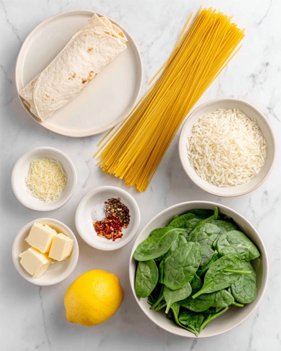 The image shows several ingredients arranged on a white marbled surface. On the left, there is a rolled white tortilla on a white plate. To its right, a small white bowl holds cooked white rice. Next to that, uncooked yellow spaghetti pasta lies stacked flat. Below the pasta, a medium white bowl is filled with fresh, green spinach leaves. In the center towards the bottom, three smaller white bowls contain different seasonings: one with salt and pepper, another with red chili flakes and grated cheese, and a third with two cubes of butter. A bright yellow lemon is placed near the rice and pasta. photo taken with an iphone --ar 4:5 --v 7