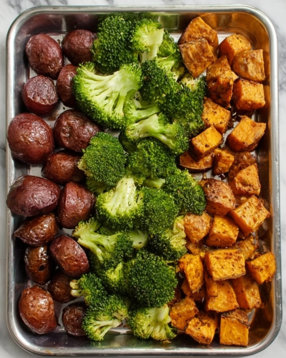 The image shows a metal tray with three sections of cooked food placed side by side. On the left, there are dark brown cooked potatoes with a shiny, slightly crispy surface. In the middle, there are bright green steamed broccoli florets with a soft texture and some light white spots on the stems. On the right, there are golden-brown roasted cubed sweet potatoes with a slightly rough texture. The tray is placed on a white marbled surface. Photo taken with an iphone --ar 4:5 --v 7
