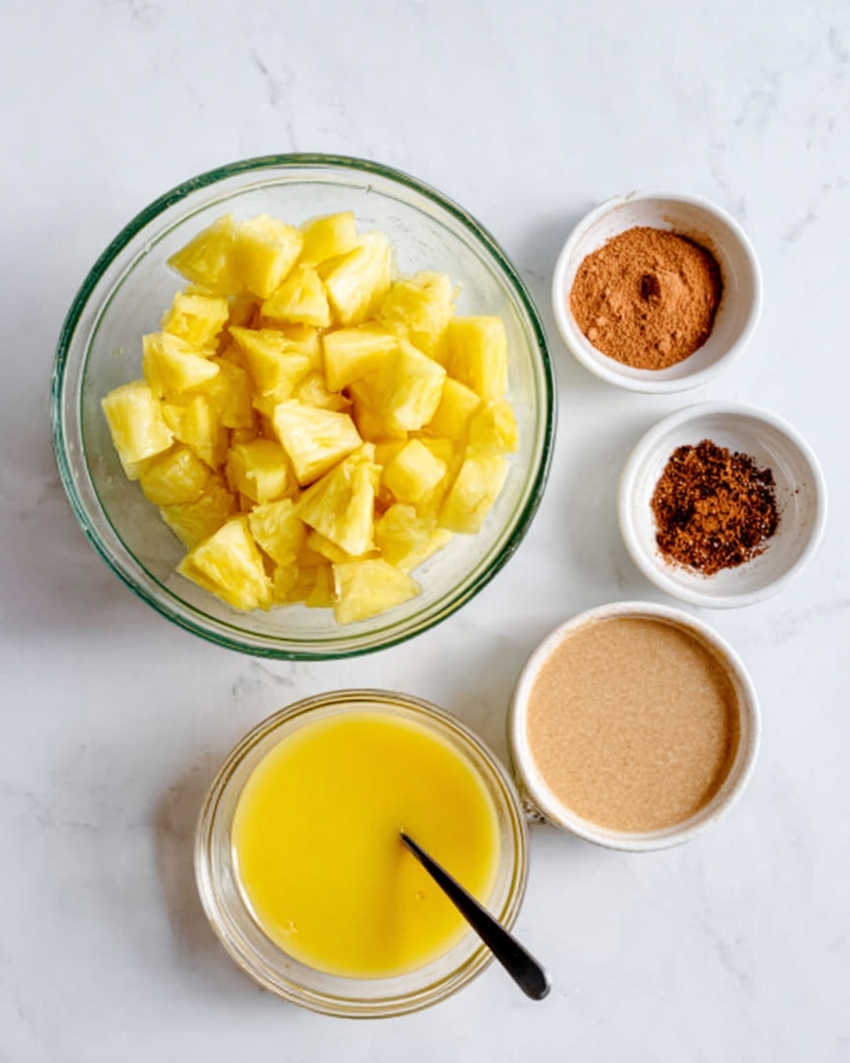 The image shows a clear glass bowl filled with bright yellow pineapple chunks as the top layer. Around the bowl are three small white dishes: one with cinnamon powder in a reddish-brown color, one with a light tan powder, and one with dark brown sugar crystals. Below these, there are two clear bowls, one filled with bright yellow melted butter and the other with a smooth beige mixture, both placed on a white marbled surface. A woman's hand holding a black spoon is gently stirring inside the glass bowl. photo taken with an iphone --ar 4:5 --v 7