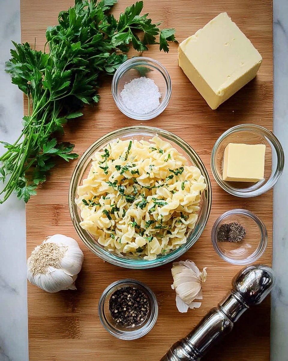 A clear glass bowl filled with cooked pasta mixed with small bits of fresh green herbs sits in the center on a wooden surface. Around it are smaller clear glass bowls with white salt, black pepper, a small square of pale yellow butter, and a small amount of white liquid. A larger block of butter and fresh green parsley are on the top left, while whole garlic bulbs and a silver pepper grinder are on the bottom right. The setting is neat and simple, with all items arranged closely together on a white marbled background. photo taken with an iphone --ar 4:5 --v 7