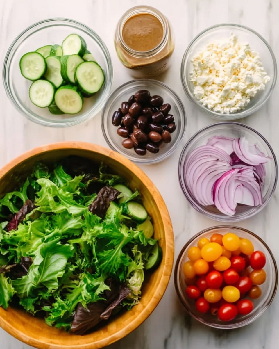 The image shows seven clear glass bowls arranged on a white marbled surface, each with different salad ingredients. Starting from the bottom, there is a large wooden bowl filled with fresh green leafy salad mix. Above it are six smaller bowls: sliced cucumber in the top left, a jar of brown dressing in the middle top, crumbled white cheese to the right of the jar, whole black olives below the jar, sliced red onions to the right of the olives, and cherry tomatoes in red, yellow, and orange shades at the bottom left. The ingredients are colorful and fresh, with distinct textures visible in each bowl. photo taken with an iphone --ar 4:5 --v 7