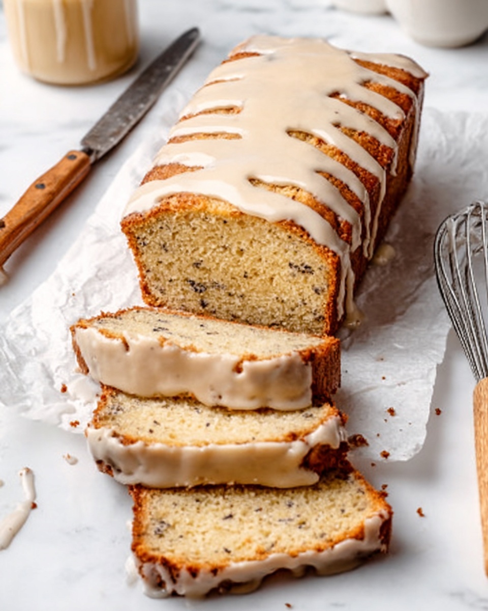 A white rectangular loaf cake covered with a shiny light cream glaze drizzled on top, placed on white parchment paper over a white marbled surface. In front of the loaf, three slices are laid out showing a soft texture with small dark specks inside the cake. Around the cake, there are a metal knife on the left, a whisk on the right, and a wooden spoon handle visible at the bottom right. photo taken with an iphone --ar 4:5 --v 7