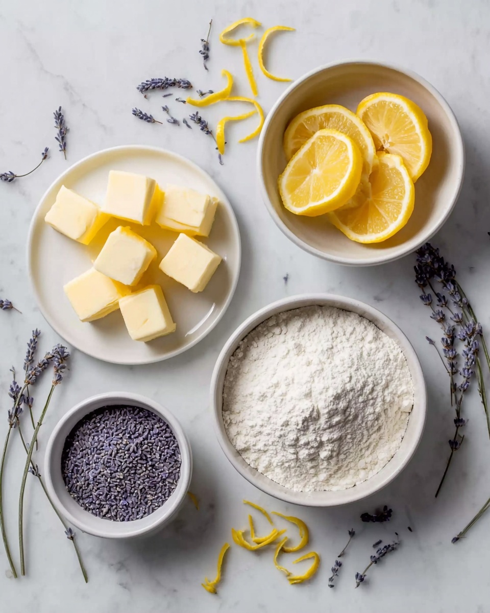 The image shows six white bowls and plates arranged on a white marbled surface. The largest bowl in the lower right is filled with white flour, piled high with a powdery texture. To its upper right is a smaller bowl filled with dried lavender buds, dark purple and finely textured. A similar small bowl with the same lavender sits below the flour, centered in the picture. Above that, a medium bowl contains four bright yellow lemon wedges with smooth shiny skin, arranged neatly. To the left, a flat white plate holds five cubes of pale yellow butter, each with a smooth surface and sharp edges. Sprigs of lavender and thin yellow lemon peel curls are scattered around the bowls on the marbled surface, adding color contrast. Photo taken with an iphone --ar 4:5 --v 7