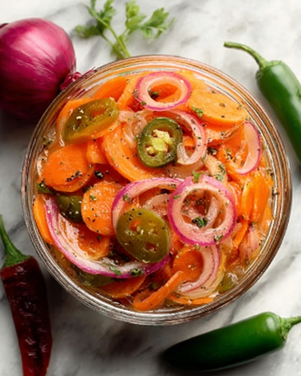 A clear bowl filled with a colorful salad made of thinly sliced orange carrots, translucent purple onion rings, and green jalapeño slices, all mixed in a light dressing with visible black pepper flakes. The bowl sits on a white marbled surface with red onion and green chili peppers nearby, adding a fresh and vibrant feel. photo taken with an iphone --ar 4:5 --v 7