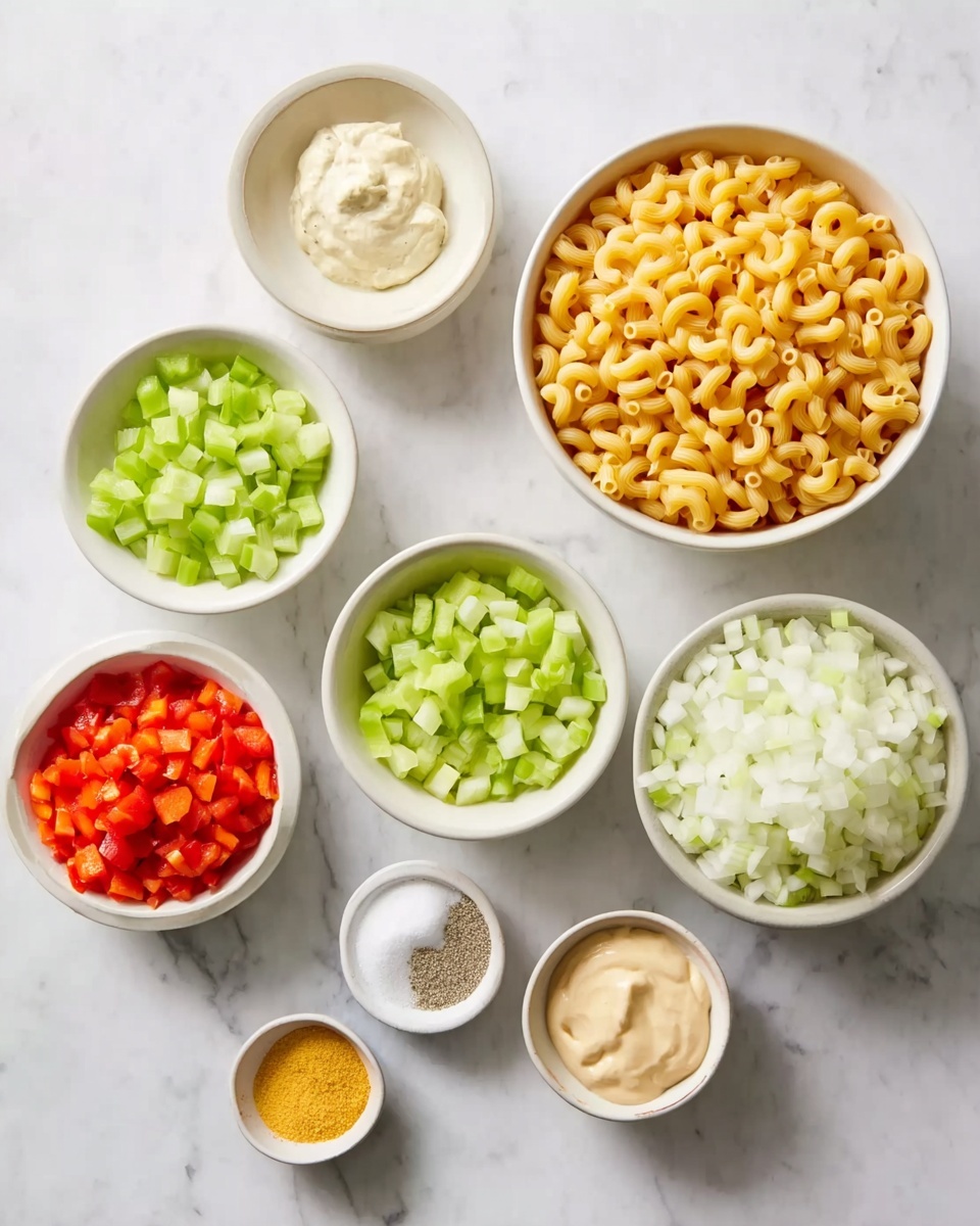 The image shows a white marbled surface with ten bowls arranged in a loose grid. The largest white bowl in the top left holds uncooked elbow macaroni, golden-yellow in color and curved in shape. Next to it, a smaller white bowl contains chopped light green celery pieces. Below the macaroni bowl, there is a white bowl with diced light green bell peppers. To the right of the celery bowl, there's another white bowl filled with chopped white onions. Above these, a small bowl holds thin orange carrot strips. Next to the carrots, a bowl with creamy beige mayonnaise sits. Below the carrots and to the right of the onions are three tiny bowls; one holds red diced tomatoes, one contains a clear white powder, and the smallest has a bright yellow mustard. Finally, a small white bowl contains a light grey powder, possibly pepper. The overall arrangement is neat and shows a mix of raw and prepared ingredients on the white marbled surface. Photo taken with an iphone --ar 4:5 --v 7