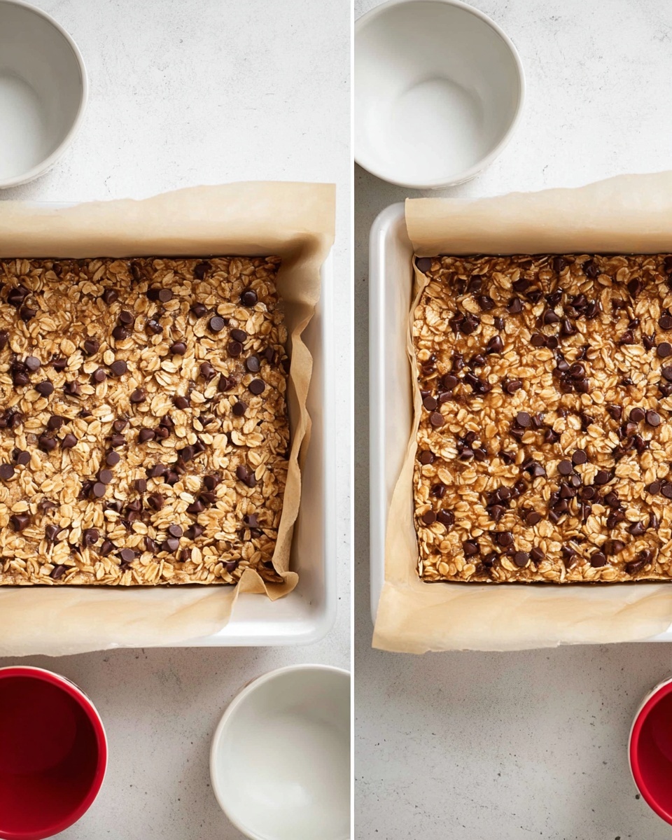 The image shows two white square baking pans lined with parchment paper on a white marbled texture surface. Both pans are filled with an oat and chocolate chip mixture spread evenly to form one visible layer. In the left pan, the mixture looks raw, with light brown oats and scattered dark chocolate chips on top. The right pan shows the baked version with a slightly darker and more uniform brown color, where the oats and chocolate chips are more combined and slightly glossy. A red cup and two white bowls are partially visible around the pans. Photo taken with an iphone --ar 4:5 --v 7