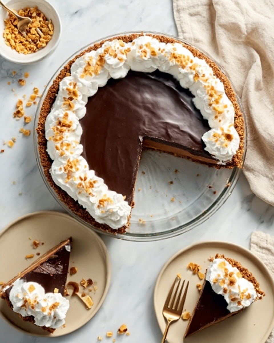 A round pie with a dark, shiny chocolate layer on top sits on a glass plate, resting on a white marbled surface. Around the edge of the pie is a thick border of white whipped cream topped with small golden brown toasted bits. One slice is missing from the pie, revealing a thick, smooth chocolate filling inside. Two pieces of pie are placed on beige plates below the main pie; one piece has a small dollop of whipped cream with toasted bits on top and a small wooden fork next to it. The scene is bright and clean with white and gold cutlery nearby and a woman's hand holding the fork over one of the slices. photo taken with an iphone --ar 4:5 --v 7