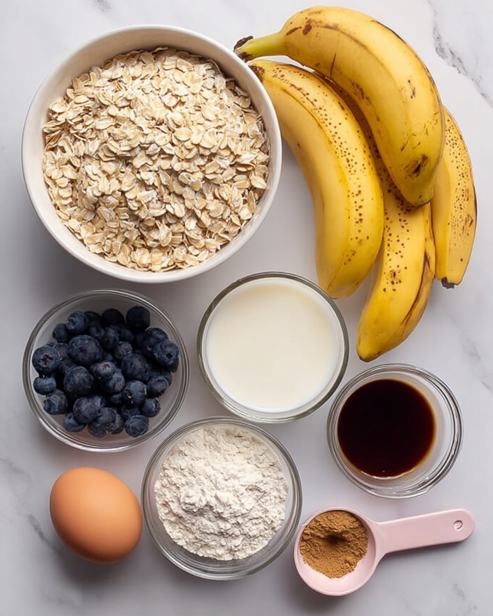 A top view of a white bowl filled with light beige rolled oats on the left side. To the right of the bowl, there are two clear glass cups—one with white milk and the other with golden honey. Below the bowls and cups are three yellow bananas with brown spots and a white small bowl filled with dark blue blueberries. Next to the blueberries is a pastel pink measuring spoon filled with white flour. A single brown egg sits below the glass cups, and there is a small clear bowl with light brown cinnamon and white baking powder. Another smaller bowl with dark brown vanilla liquid is placed near the cinnamon mixture. All items are arranged neatly on a white marbled surface photo taken with an iphone --ar 4:5 --v 7