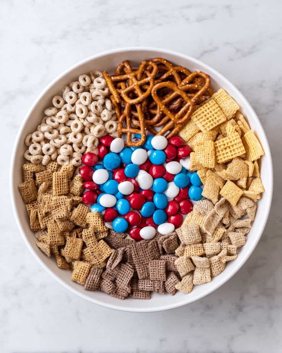 A large white bowl sits on a white marbled surface, filled with six different snack layers arranged in sections. At the top right, there are light beige oat cereal loops. To their right, golden yellow square cereal pieces with a woven texture make up the next section. At the bottom right and bottom left, there are light beige and dark brown square cereals, both with a crunchy, airy look. At the top left, light brown pretzel sticks are piled together. In the center, there is a mound of round candy-coated chocolates in red, blue, and white colors, some overlapping the cereal layers around them. The colors and textures contrast clearly, creating a patterned mix inside the bowl. Photo taken with an iphone --ar 4:5 --v 7