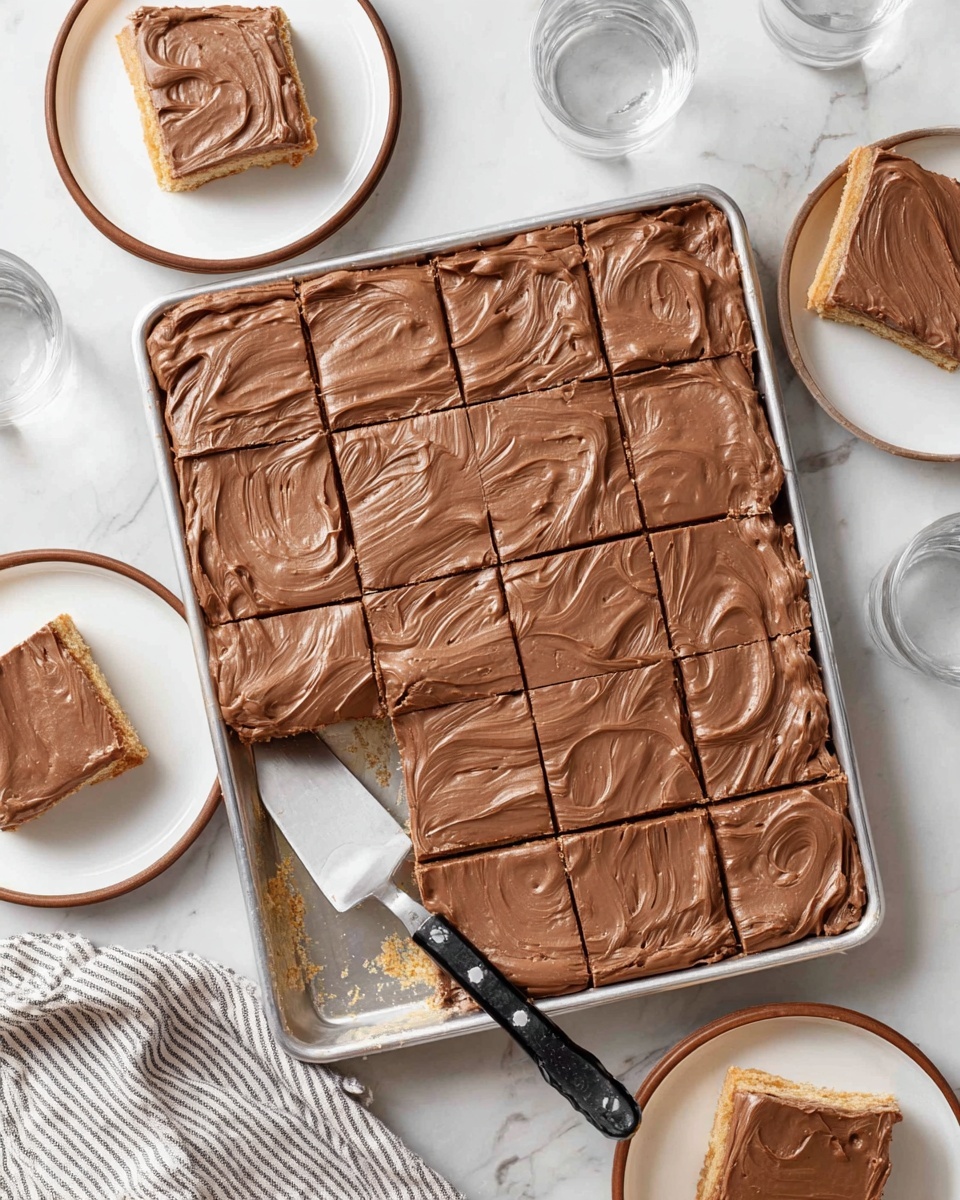 The image shows a large rectangular tray with a dessert bar cut into 15 squares. The dessert has two clear layers: the bottom layer is a light golden brown crust, and the top layer is a smooth, creamy milk chocolate frosting with visible swirls and spread marks. A few pieces are taken out and placed around the tray – one on a white plate with brown rim on the upper left side and two more near the bottom. There's a metal spatula with a black handle resting in the tray. The background is a white marbled surface, and there are two empty white plates with brown rims and a clear glass of water placed around the tray. A striped cloth is also visible at the bottom edge of the image photo taken with an iphone --ar 4:5 --v 7