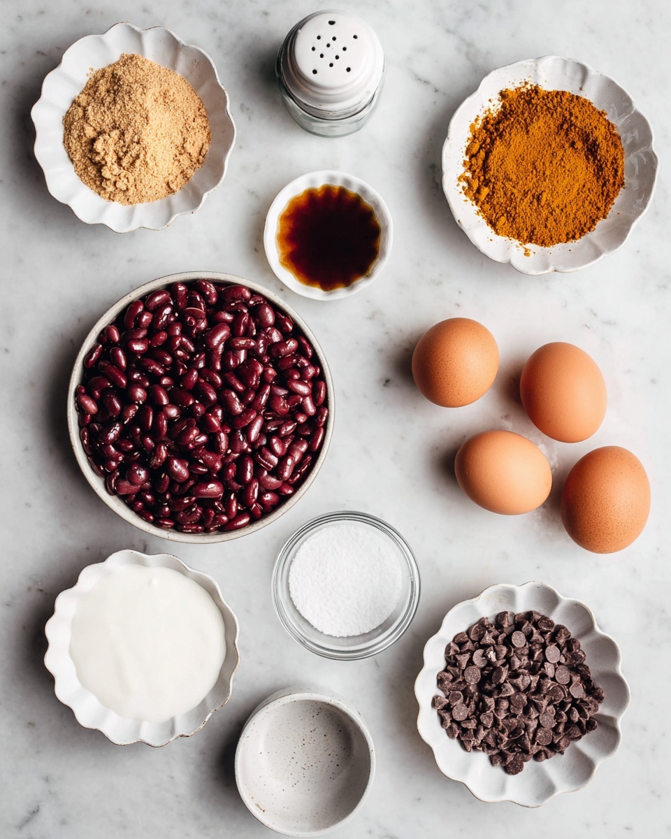 The image shows eight different ingredients in white bowls or placed directly on a white marbled surface. In the middle, there is a larger round white bowl filled with dark red kidney beans with a smooth and shiny texture. Above it, slightly to the left, a scalloped white bowl holds light brown powdery graham cracker crumbs. Next to it, on the right, a round white bowl contains a mound of rusty orange cinnamon powder. To the right of the cinnamon, a small white bowl holds a dark brown liquid, likely vanilla extract. Below the vanilla, three brown eggs with smooth shells rest on the white marbled texture. To the bottom right, a scalloped white bowl is filled with small round dark brown chocolate chips. At the bottom left, another scalloped white bowl contains a creamy white substance, probably yogurt. In between the yogurt and chocolate chips, there is a small salt shaker and a white container with salt spilling slightly. The setup is clean and bright. photo taken with an iphone --ar 4:5 --v 7