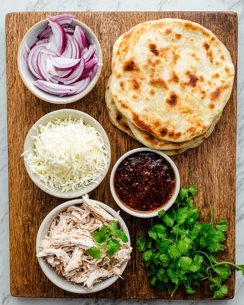 A wooden board holds several white bowls and flatbreads. One bowl contains thinly sliced red onions with purple and white stripes, placed on the upper left. Next to it on the right is a small bowl filled with dark reddish-brown sauce. On the bottom left, there is a bowl filled with shredded white cheese, and beside it on the right is a bowl with shredded cooked chicken, topped with a few green cilantro leaves. To the far right, there are three stacked golden flatbreads with light brown spots on a white marbled surface. A bunch of fresh green cilantro is also visible on the right side of the board. Photo taken with an iphone --ar 4:5 --v 7