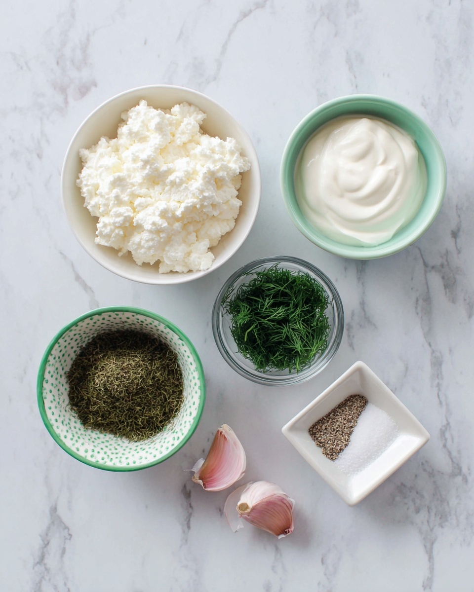 The image shows six ingredients placed neatly on a white marbled surface. At the top left, there is a white bowl filled with lumpy white cottage cheese. Next to it on the right, a white bowl holds smooth white yogurt. To the right of that, a small clear glass bowl contains chopped green herbs. Below these, a small white bowl with green trim holds dark green dried dill. To its right, a small white square dish contains a mix of white salt and black pepper. In the center bottom, two peeled garlic cloves rest on the surface. Photo taken with an iphone --ar 4:5 --v 7