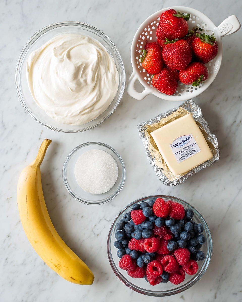 A top view of different food ingredients placed on a white marbled surface, including a clear glass bowl filled with smooth white whipped cream at the top left, a white colander with bright red strawberries on the top right, a block of butter wrapped in foil slightly below the whipped cream, a clear glass bowl with fresh blueberries and red raspberries mixed inside on the bottom right, a closed container of strawberry yogurt at the middle left, a small clear glass bowl filled with white granulated sugar below the butter, and a ripe yellow banana positioned at the bottom left. The items are spaced apart neatly and shown clearly with natural lighting photo taken with an iphone --ar 4:5 --v 7