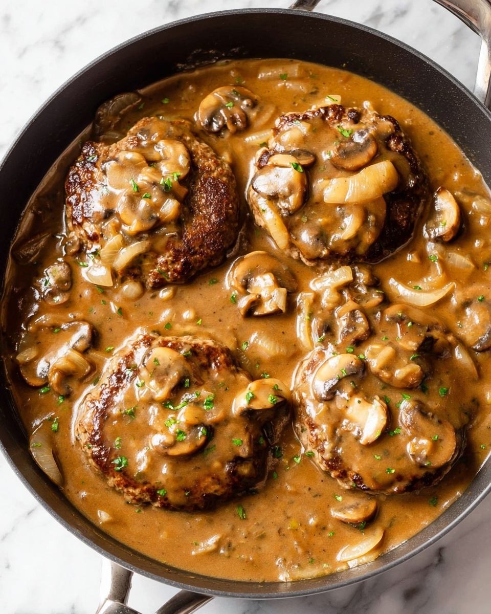 The dish is on a white plate with a white marbled surface underneath. There are three main parts: on the left, a large scoop of creamy mashed potatoes with a smooth, fluffy texture in off-white color; on top of the potatoes, golden brown sautéed mushrooms and onions covered in a rich, dark brown mushroom gravy. To the right of the mashed potatoes, there is a browned round meat patty with a slightly crisp outer layer that is also covered with the same mushroom gravy containing mushrooms and onions. At the bottom right of the plate, a neat pile of bright green cooked green beans adds a fresh and crisp look, with a few mushrooms and onion pieces lightly scattered on top. The gravy slightly spreads around the plate edges, connecting all elements. Photo taken with an iphone --ar 4:5 --v 7