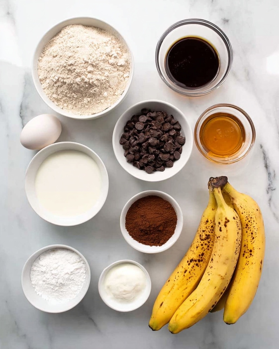 The image shows a white marbled surface with several small white bowls and loose items arranged neatly. There is a bowl with light brown flour at the top left, a small glass bowl with dark brown vanilla extract at the top right, and a bowl with golden brown honey below the vanilla. On the left side, an egg and a small glass of white milk are next to the flour. In the center, a white bowl contains dark chocolate chips. Below it, a bowl holds a medium brown cocoa powder, next to a bowl with white yogurt or sour cream. At the bottom left, a small bowl contains white baking soda or powder. To the right, there are two ripe yellow bananas with spots. The layout is clean, with each ingredient clearly visible and separated photo taken with an iphone --ar 4:5 --v 7