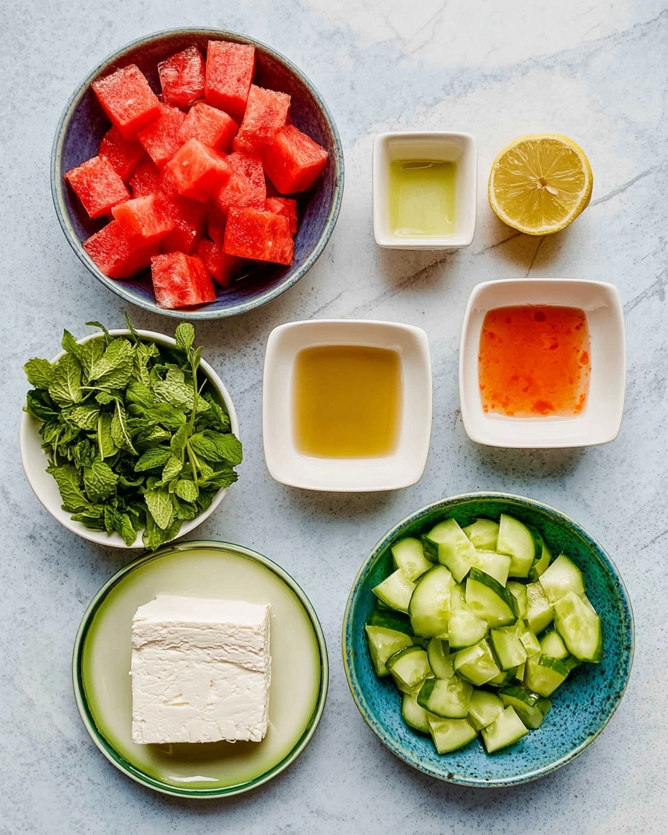 The image shows six bowls on a white marbled surface. The top left bowl contains bright red cubes of watermelon with a juicy texture. To the top right side, there is half a lemon with a light greenish-yellow color, next to three small white square bowls; one has orange-red sauce, another golden liquid, and the last is empty. Below, on the left, a bowl with fresh green herbs, featuring both flat and leafy textures. In the center, a white plate with a green rim holds a thick, creamy white block of cheese. On the right side, a bowl filled with bright green cucumber pieces, cut into chunks showing pale green flesh and dark green skin. Photo taken with an iphone --ar 4:5 --v 7