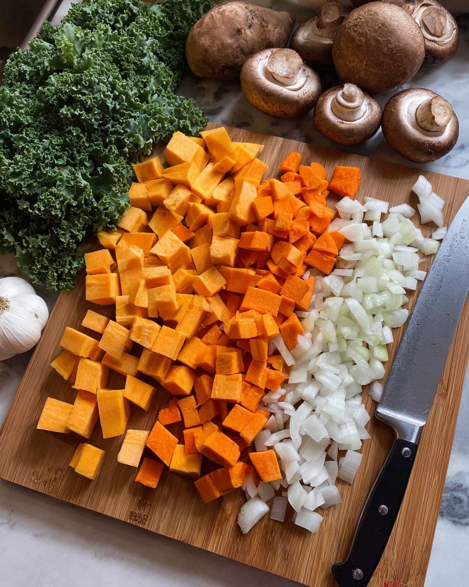 The image shows a wooden board on a white marbled surface with different chopped vegetables neatly arranged in layers from left to right: small orange cubes of sweet potato in the front left, larger butternut squash cubes in the middle, smaller orange carrot pieces next, and white diced onions on the right. Behind the board, there are whole brown mushrooms, a garlic bulb, fresh green leafy kale, and a large knife resting on the board's right edge. Photo taken with an iphone --ar 4:5 --v 7