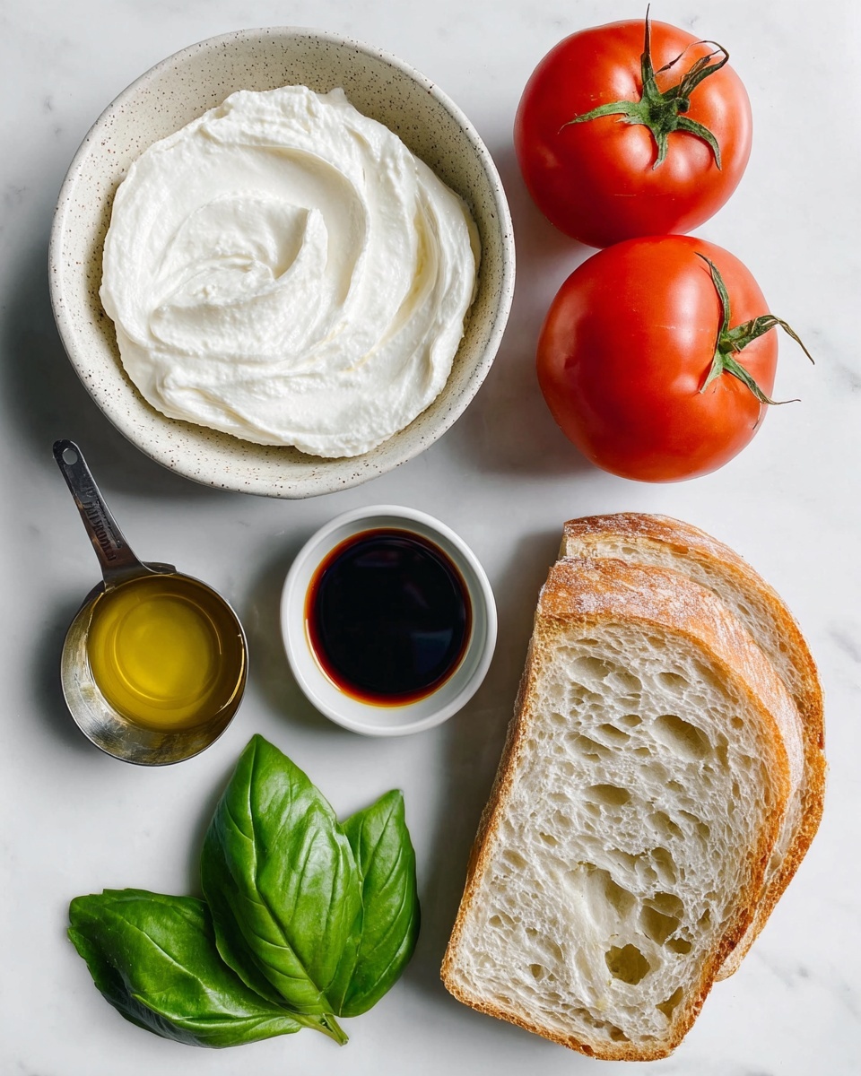 The image shows ingredients for a fresh dish laid out on a white marbled surface. There are two bright red tomatoes with green stems placed near the top right. Below them is a thick slice of light brown crusty bread with a soft, holey interior. To the left of the bread, three fresh green basil leaves are arranged. In the middle left, a speckled white bowl holds smooth, white creamy cheese or spread with a slightly swirled texture on top. Above this bowl is a small white bowl filled with dark brown balsamic vinegar. Next to that, a metal measuring spoon contains a golden yellow liquid, likely olive oil. Photo taken with an iphone --ar 4:5 --v 7
