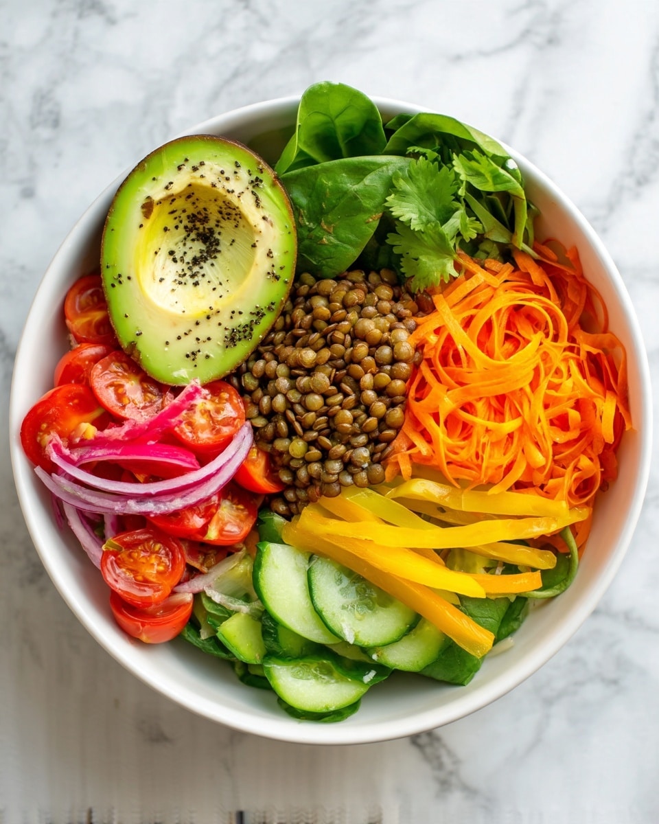 A bowl of healthy salad with five layers is shown on a white marbled surface. The bottom layer is brown lentils covering the base, topped with fresh spinach leaves. Above spinach are several colorful vegetable piles: bright yellow bell pepper strips on the left, purple shredded cabbage next to it, orange shredded carrots towards the center, and green cucumber slices with red pepper flakes on the right. In the center, there is some roasted cauliflower with bright pink pickled onions and a few fresh cilantro leaves scattered on top. A gold spoon rests on the right side of the bowl. Nearby, there is half an avocado sprinkled with black pepper, a bunch of fresh cilantro leaves, and a small white bowl with creamy dressing sprinkled with black pepper and containing a metal whisk. In the bottom right, there is a dark plate with light toasted almond slices. Photo taken with an iphone --ar 4:5 --v 7