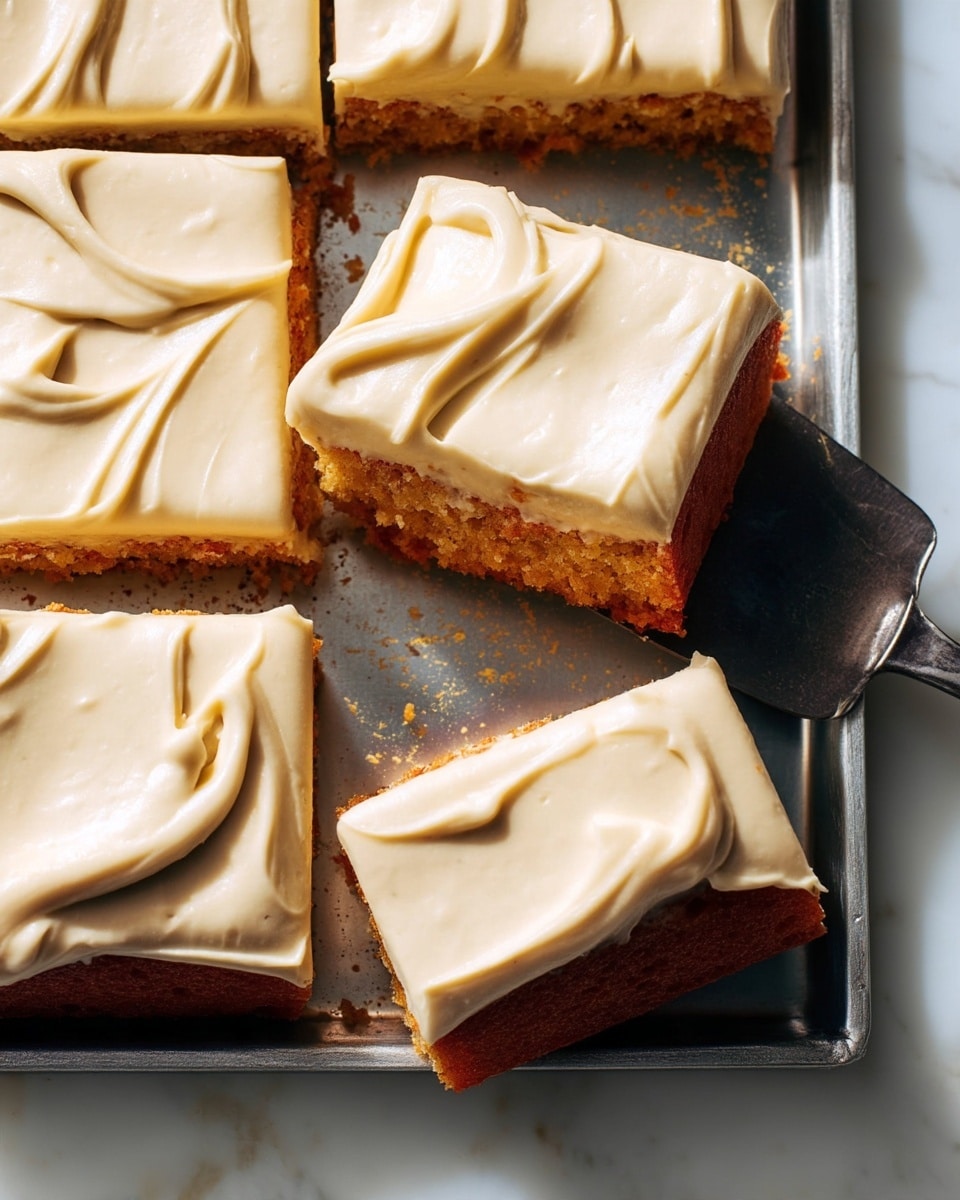 The image shows several rectangular pieces of a two-layer dessert arranged closely on a metal tray. The bottom layer is a golden brown cake with a dense texture, and the top layer is a thick, smooth cream frosting in a light beige color spread with soft swirls. The pieces are unevenly cut, and one piece is slightly lifted by a dark metal spatula near the center. The surface under the tray is a white marbled texture. Photo taken with an iphone --ar 4:5 --v 7